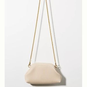 Cute cream colored Anthropologie purse!